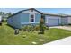 Charming single-story home with a well-maintained lawn, lovely landscaping, and a two-car garage at 3214 Viceroy Ct, Kissimmee, FL 34759