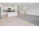 Open-concept kitchen with white cabinets, a center island, and tile flooring at 3214 Viceroy Ct, Kissimmee, FL 34759