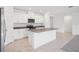 Bright kitchen with white cabinetry, stainless steel appliances, and a granite-topped island at 3214 Viceroy Ct, Kissimmee, FL 34759