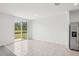 Bright, open living area with sliding glass doors leading to an outdoor view at 3214 Viceroy Ct, Kissimmee, FL 34759