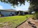 Spacious backyard featuring green grass and nice landscaping perfect for outdoor enjoyment at 3333 Sagebrush St, Harmony, FL 34773