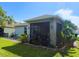 This beautiful home boasts a lovely screened-in patio and nicely manicured lawn and garden at 3333 Sagebrush St, Harmony, FL 34773