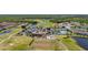 Stunning aerial view of the community golf course and surrounding amenities at 3391 Cortland Dr, Davenport, FL 33837