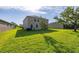 Expansive backyard featuring a lush green lawn, ideal for outdoor activities and relaxation at 3391 Cortland Dr, Davenport, FL 33837