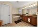 Bright bathroom featuring a soaking tub, double vanity with granite counters, and decorative tile work at 3391 Cortland Dr, Davenport, FL 33837