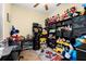 Bright bedroom with a ceiling fan and tile flooring with a Disney theme at 3391 Cortland Dr, Davenport, FL 33837