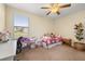 Bedroom with carpet and many stuffed animals with a lot of natural light from the window at 3391 Cortland Dr, Davenport, FL 33837