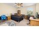 Bedroom with a ceiling fan, carpet, desk, and decor with Star Wars theming at 3391 Cortland Dr, Davenport, FL 33837