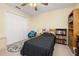 Cozy bedroom featuring carpet, a ceiling fan, and decor with books and stuffed animals at 3391 Cortland Dr, Davenport, FL 33837