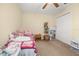 Charming bedroom featuring carpet, a ceiling fan, and a closet for ample storage at 3391 Cortland Dr, Davenport, FL 33837
