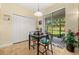 Cozy dining area featuring a sliding glass door to a screened patio at 3391 Cortland Dr, Davenport, FL 33837