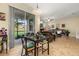 Cozy dining area adjacent to the living room with easy access to the screened patio at 3391 Cortland Dr, Davenport, FL 33837
