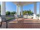 Covered entrance to the Providence community features brick pavers and two benches at 3391 Cortland Dr, Davenport, FL 33837