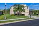 Two-story home with a well-manicured lawn, lush landscaping, and a two-car garage at 3391 Cortland Dr, Davenport, FL 33837