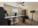 Bright home office with large desk, ceiling fan, and a window providing natural light at 3391 Cortland Dr, Davenport, FL 33837