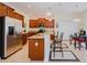 Bright kitchen boasts stainless steel appliances, granite countertops, and eat-in breakfast nook at 3391 Cortland Dr, Davenport, FL 33837