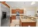 Spacious kitchen with stainless steel appliances, granite countertops, and wood cabinetry at 3391 Cortland Dr, Davenport, FL 33837