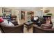 Stylish living room with neutral tones, tile flooring, and an open concept design at 3391 Cortland Dr, Davenport, FL 33837