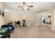 Versatile loft area with ample natural light, ceiling fan, and neutral carpet flooring at 3391 Cortland Dr, Davenport, FL 33837