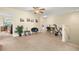 Spacious loft area with a ceiling fan, carpeted floors, and versatile layout for various activities at 3391 Cortland Dr, Davenport, FL 33837