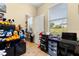 Bright office space with a desk, shelving, and a window offering plenty of natural light at 3391 Cortland Dr, Davenport, FL 33837
