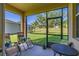 Relaxing screened patio overlooking a lush, green backyard with mature trees at 3391 Cortland Dr, Davenport, FL 33837