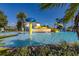 Resort-style pool area with colorful water features, a slide, and plenty of seating at 3391 Cortland Dr, Davenport, FL 33837