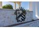 A closer view of Providence sign at the gated entrance with white stone and decorative wrought iron at 3391 Cortland Dr, Davenport, FL 33837