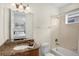Bathroom featuring granite countertops, a tub-shower combo, and bright lighting at 341 Lasso Dr, Kissimmee, FL 34747