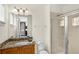Bathroom with granite countertops, a walk-in shower, and good lighting at 341 Lasso Dr, Kissimmee, FL 34747