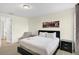 Bedroom featuring a queen-sized bed, chair and ensuite bathroom at 341 Lasso Dr, Kissimmee, FL 34747