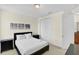 Bright bedroom featuring a queen-sized bed and a closet at 341 Lasso Dr, Kissimmee, FL 34747