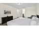 Comfortable bedroom featuring a queen-sized bed, chair, and ensuite bathroom at 341 Lasso Dr, Kissimmee, FL 34747