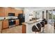 Modern kitchen with breakfast bar, stainless steel appliances, and easy access to outdoor patio at 341 Lasso Dr, Kissimmee, FL 34747