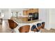 Contemporary kitchen featuring granite countertops, stainless appliances, and breakfast bar at 341 Lasso Dr, Kissimmee, FL 34747