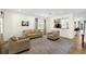 Cozy living room includes comfortable seating and a view of the adjacent kitchen at 341 Lasso Dr, Kissimmee, FL 34747