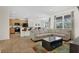 Open-concept living area with tile floors, a comfortable sectional sofa, and a kitchen view at 341 Lasso Dr, Kissimmee, FL 34747
