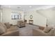 Open-concept living area with staircase, seamlessly connecting to the kitchen at 341 Lasso Dr, Kissimmee, FL 34747