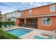 A backyard pool features lounge chairs, patio set, and secure fencing for safety at 341 Lasso Dr, Kissimmee, FL 34747
