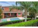 The backyard features a refreshing pool, covered patio, lounge chairs, and lush landscaping for the perfect outdoor oasis at 341 Lasso Dr, Kissimmee, FL 34747