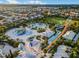 Aerial view of community waterpark with slides, splash pad, pool, and lounge seating at 341 Lasso Dr, Kissimmee, FL 34747