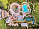 Aerial view of the community waterpark featuring colorful slides, pools, and lounging areas at 341 Lasso Dr, Kissimmee, FL 34747