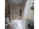 This bathroom features a tub and shower combination with glass doors and ceramic tile at 4345 Old Colony Rd, Mulberry, FL 33860