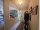 Inviting entryway with tiled floor, coat rack, interior window, and neutral decor at 4345 Old Colony Rd, Mulberry, FL 33860