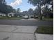 Ranch-style home with a two-car garage and mature trees at 4345 Old Colony Rd, Mulberry, FL 33860