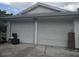 Double-car garage doors on the side of the house at 4345 Old Colony Rd, Mulberry, FL 33860