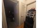 Hallway with a closed door with storage and adjacent open door to a room at 4345 Old Colony Rd, Mulberry, FL 33860