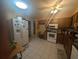 Traditional style kitchen features wood cabinetry, stainless appliances, and a ceiling fan at 4345 Old Colony Rd, Mulberry, FL 33860