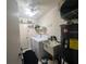 Functional laundry room with washer, dryer, utility sink, and water heater at 4345 Old Colony Rd, Mulberry, FL 33860