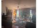 Living room with hardwood floors and a stone fireplace at 4345 Old Colony Rd, Mulberry, FL 33860